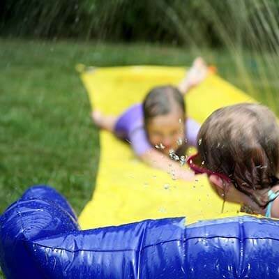 image-2 kids doing a slip and slide